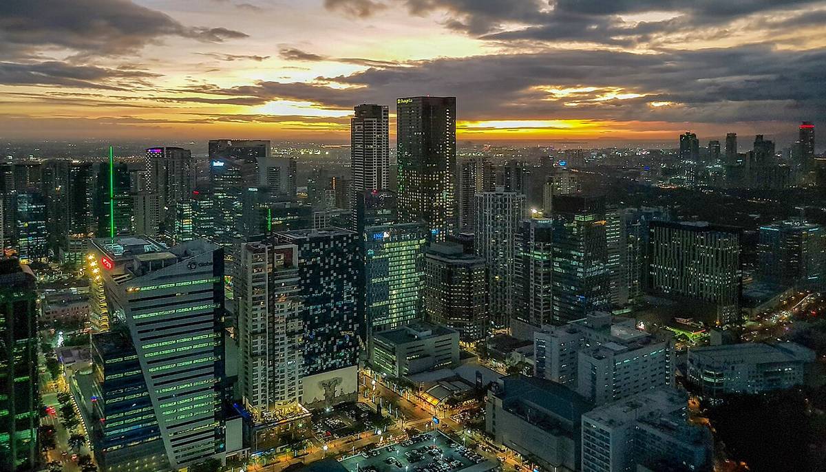The Bonifacio Global City and Makati skylines at sunset
