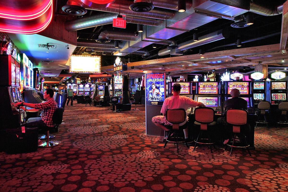 Rows of slot machines on a casino gaming floor