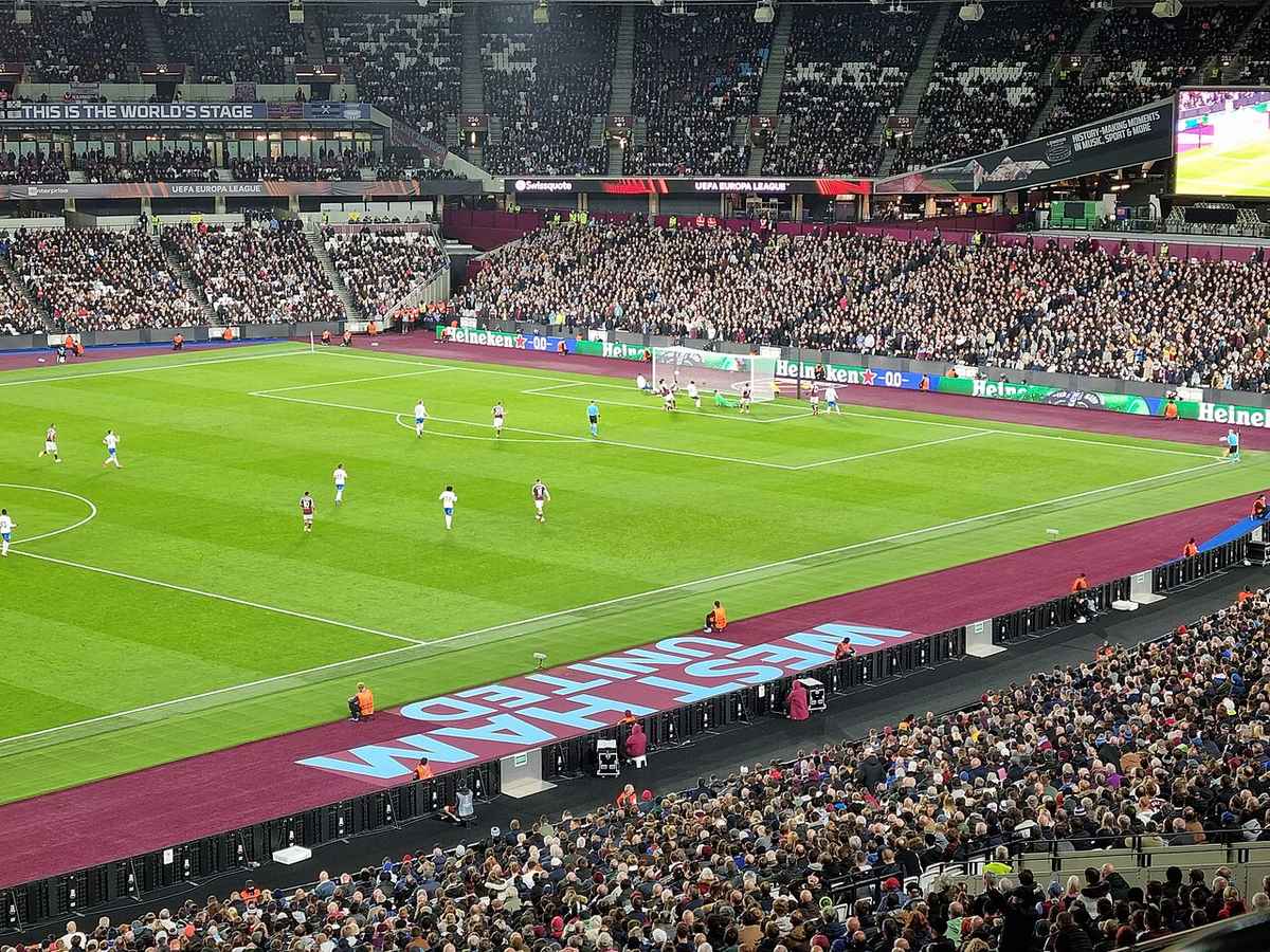 Packed stands at the London Stadium during an evening European football match